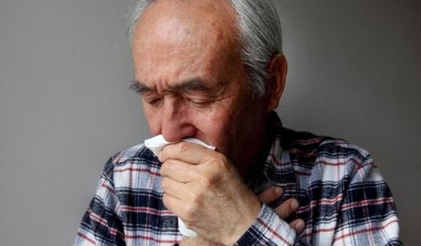man coughing